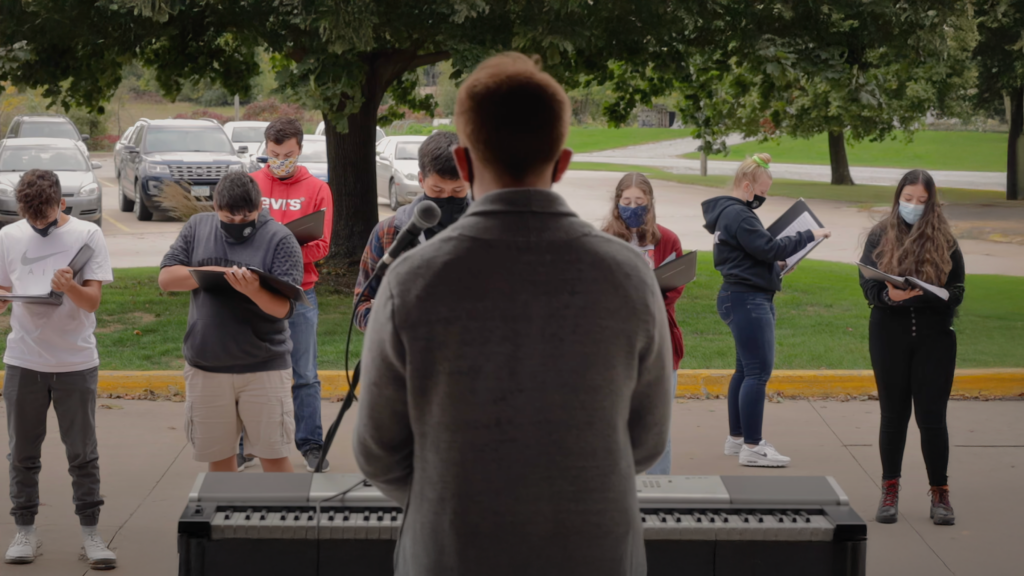 Teacher conducting an outdoor music